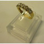 An 18ct yellow gold ring set with 6 brilliant cut diamonds. Ring size approx N/O