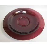 A large 18c/19c Chinese Beijing amethyst coloured circular glass dish, 31cm diam.
