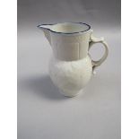 A late 18c/early 19c Caughley small cabbage leaf mask jug, white glazed with blue upper rim, under