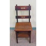 A Victorian oak metamorphic library chair with a two rail back panel, hinged and folding to form