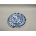 A blue and white plate printed with a mounted traveller and attendant with ruined temple in the