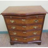 A George III style small proportion mahogany burr wood veneered serpentine chest with four long