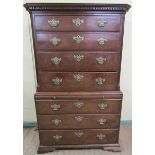 A George III mahogany chest on chest, the upper section under a dentile moulded cornice, having four