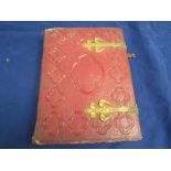 A Victorian photograph album with twenty four double sided pages, each containing four portrait