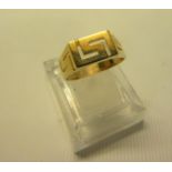 A 14ct gold gents ring in a greek key design. Stamped 585. Ring size approx U/V. Weight approx 5g