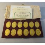 Twelve sterling silver gold plated ingots, and being the Arms of the Prince and Princess of Wales,