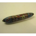 A late 19c enamel cloisonne needle case of cylindrical form with screw off end, decorated with