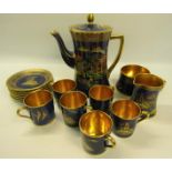 A 1920's Carltonware Marcado coffee service decorated on a blue ground with gilt lining,