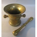 An 18c bronze mortar and pestle, the mortar with a 13cm mouth, 12cm h.
