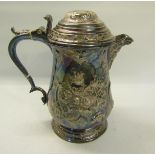 A 19c Georgian style silver plated baluster jug with mask spout, hinged domed cover with thumb piece