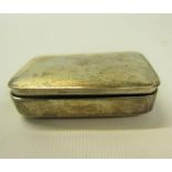 A late Georgian silver snuff box of plain rectangular form with a slightly domed hinged cover,
