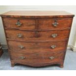 An early 19c mahogany bow front chest of two short and three long graduated drawers with pierced