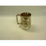 A Victorian silver tankard chased with decorated cartouche, makers mark for Henry Wilkinson & Co,