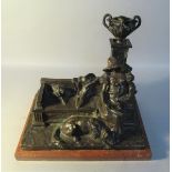 An early 20c bronze lamp stand electrolier by Oskar Hertel in the form of a lady reading a book