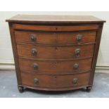 A 19c mahogany bow chest of five long drawers, the shallow top drawer fitted, having lion mask