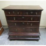 An early 18c walnut chest of two short and three long graduated drawers, all with channelled