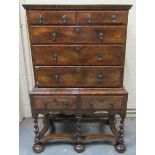 An early 18c style figured walnut chest of two short and three long graduated drawers under a