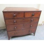 An early 19c mahogany chest of two short and three long drawers with turned bun handles and