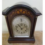 A late 19c German mantel clock in mahogany stained case with round top and plain columns flanking