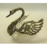 A swan table salt with a cut glass body, continental silver wings, neck and head.