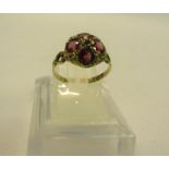 An Edwardian yellow gold 12ct amethyst and emerald set ring, size N.