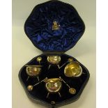 A boxed set of four silver cauldron shaped table salts with spoons, makers mark for Mappin & Webb,