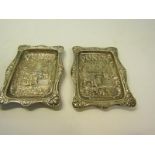 A pair of late Victorian silver Mr Punch dishes, embossed and chased with wavy embossed edges,