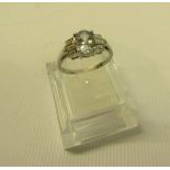An 18ct white gold aquamarine and cut diamond ring, size P.