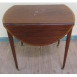 An early 19c mahogany oval Pembroke table, rosewood cross banded with satin wood and ebony line,