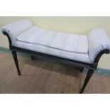 A 19c upholstered window seat of Neo-Classical design having a gadroon carved seat rail and