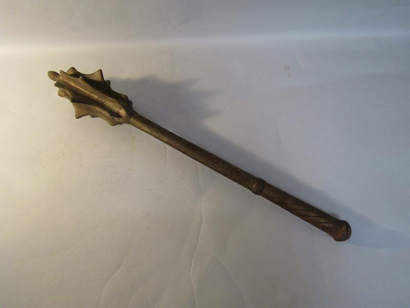 An antique iron mace with a seven flange head, 60cm l.