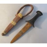 A 19c Indian fighting knife with carved ebony handle, double edged blade with leather sheath and