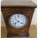 A late French mantel clock in rectangular rosewood case in inlays to front and sides depicting bowls