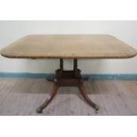 A 19c mahogany tilt top pedestal table of rectangular form with rounded corners, cross banded and