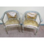 A pair of 19c painted and parcel gilt upholstered bow back open armchairs with reeded and turned arm