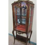 A late 19c Louis XV style gilt bronze mounted kingwood vitrine with a single glazed door, painted