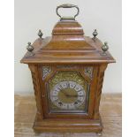 A late 19c German bracket clock by Lenzkirch in burr maple bell top case. The 12.5cm arched dial