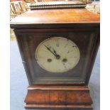 A mid 19c Black Forest mantel clock in rectangular case with flat cushion top and ogive base. The