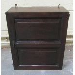 A late 17c/early 18c oak wall cabinet fitted with two long and four short drawers and a central deep