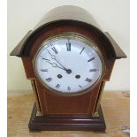 A late 19c French mantel clock in round topped mahogany case with inset brass columns to the front