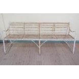 A 19c white painted slatted iron garden seat, 214cm l.