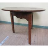A late 18c oak cricket table of circular form supported on three triangular tapering legs with