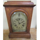 A late 19c German mantel clock in stained hardwood rectangular case with flat top and plinth base.