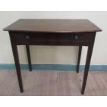 A George III mahogany slight bow front side table of rectangular form fitted one long frieze