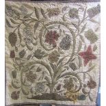 An 18c Flemish tapestry decorated with tulips and other flowers, worked in silk and gilt wire on a