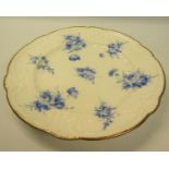 A 19c Nantgarw porcelain plate, hand painted with blue floral sprays, moulded and shaped border,