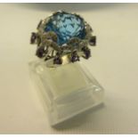An 18ct white gold blue topaz and amethyst set ring, sixe O/P.