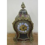 A late 19c French mantel clock in waisted boullework case of brass and tortoiseshell decorated