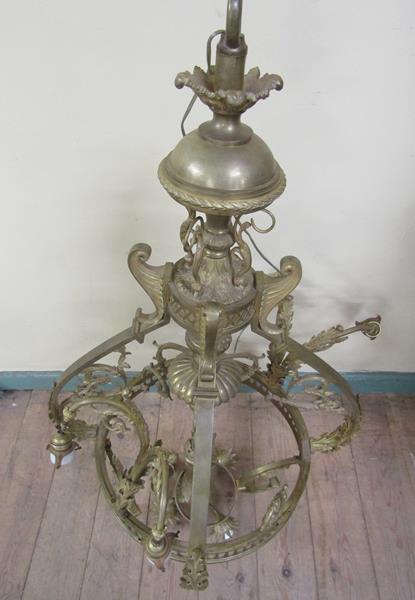 An early 20c gilded brass four light chandelier, leaf and scroll cast, 110cm h, 75cm diam max. - Image 2 of 3