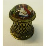 A late Victorian gilt metal vesta box of pierced cylindrical form on a circular base with strike and